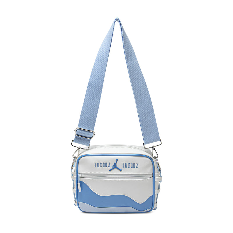 Blue and white crossbody bag with adjustable long shoulder strap and front zip pocket