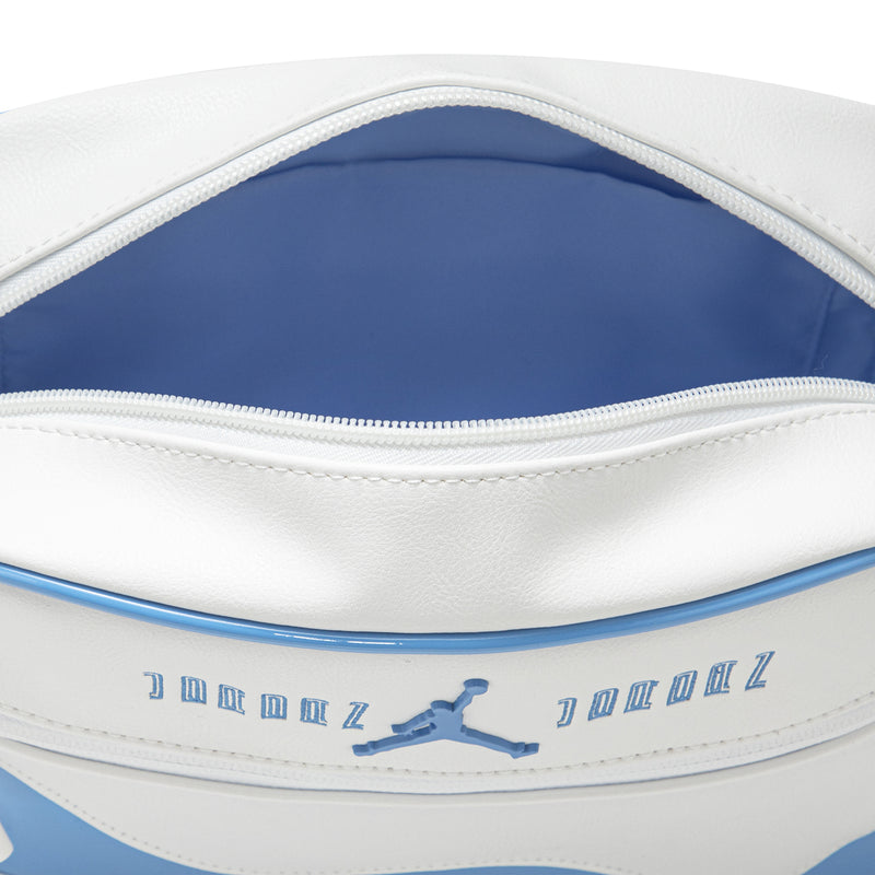 Blue-lined top zipper opening and Jumpman logo on white trim crossbody bag