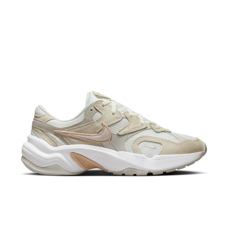 Light bone women's running sneaker with mesh upper, laces, and curved swoosh logo