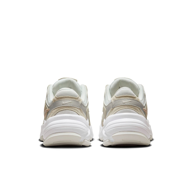 Light bone sneakers from heel, showing padded back and layered white sole