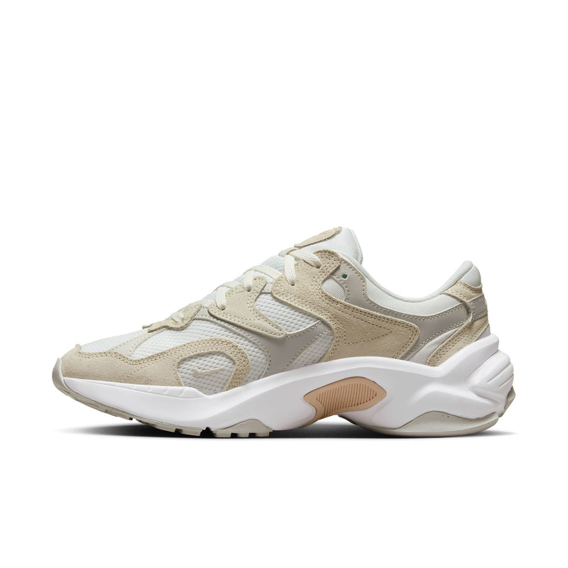 Light bone lace-up running sneaker with textured panels, swoosh detail, and thick sole
