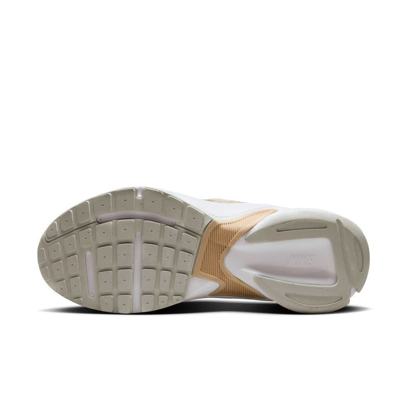 Light bone sneaker outsole with tread pattern and white rim around the bottom