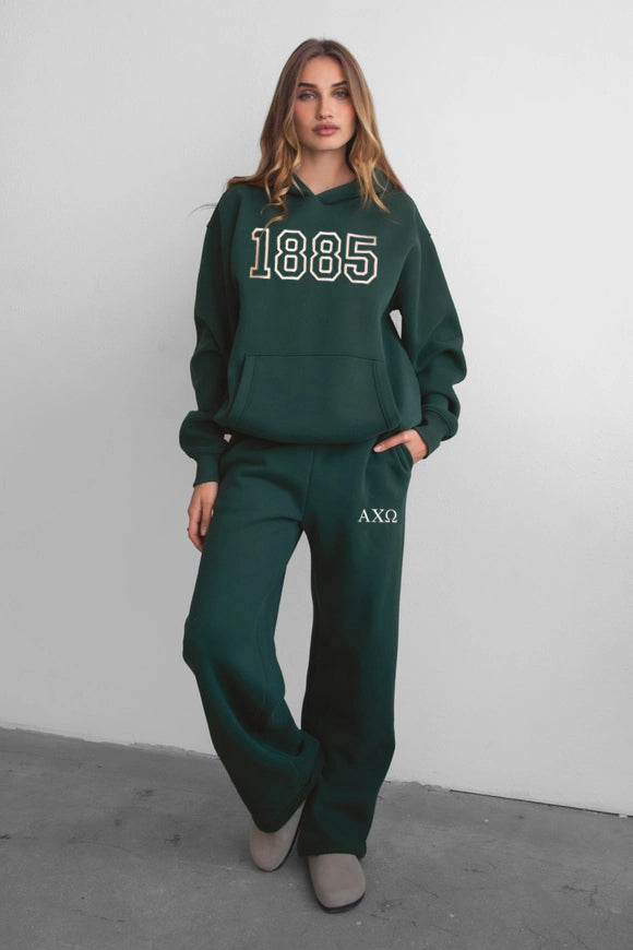 Front view of oversized hoodie with bold varsity numbers and kangaroo pocket.