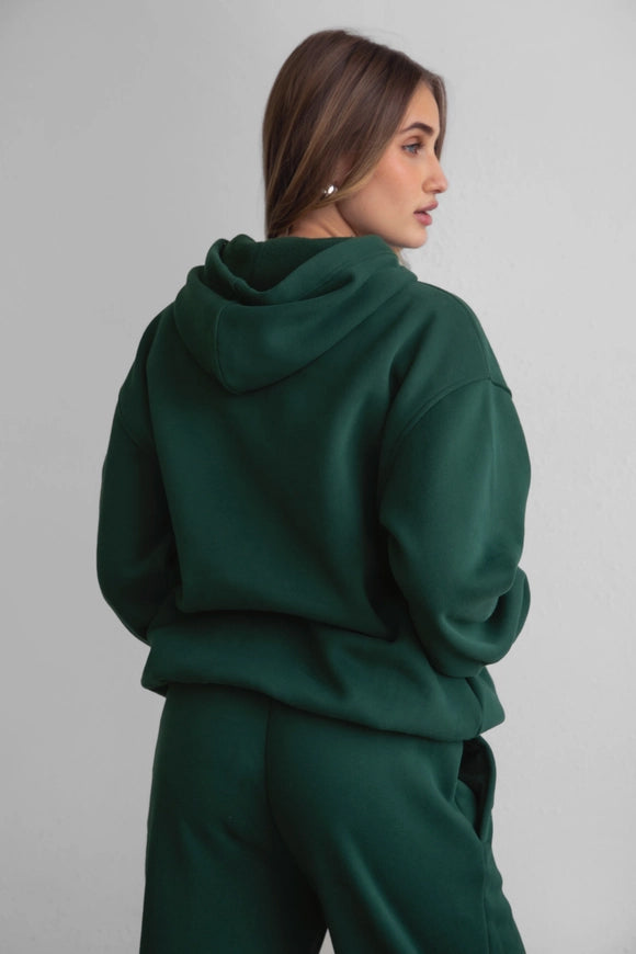 Side view of hoodie showing relaxed fit and dropped shoulder seams.