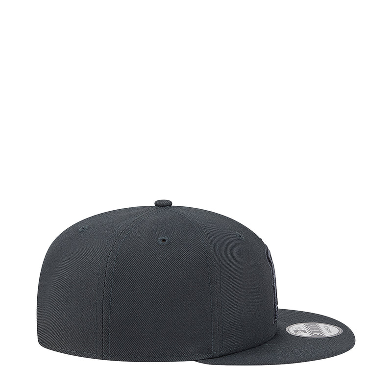 Charcoal baseball cap with curved brim and stitched crown panels, side view