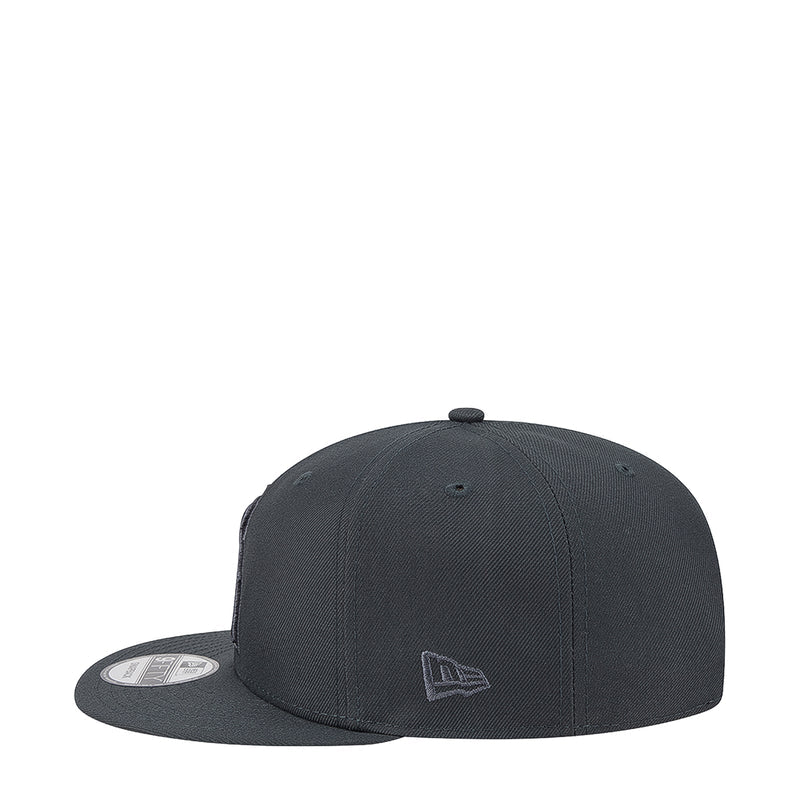 Charcoal baseball cap with small A emblem on the front, angled view