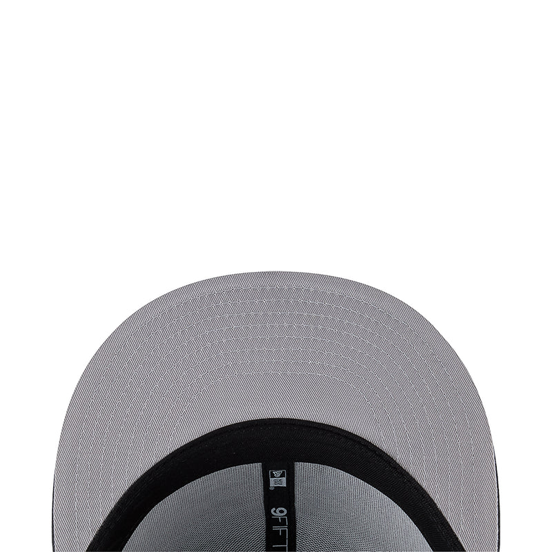Baseball cap interior showing black inner band and vertical size label