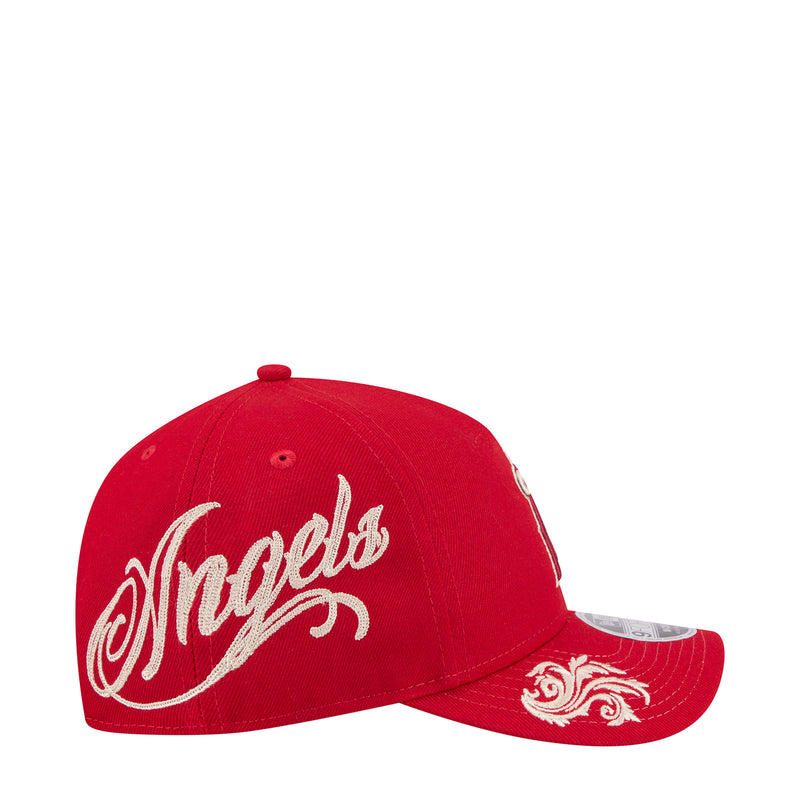 Red baseball cap with white Angels script logo on the side and matching brim details.
