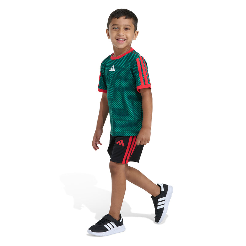 Kids green soccer kit side view: striped jersey sleeves and black shorts with red accents.