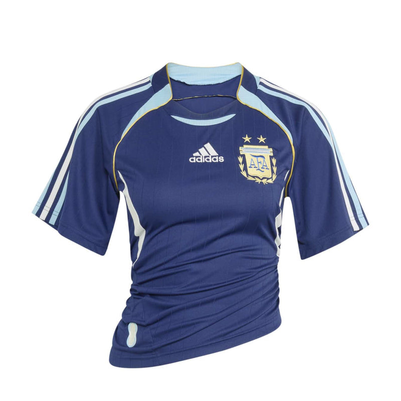 Women's dark blue soccer jersey with light blue shoulder stripes and yellow trim