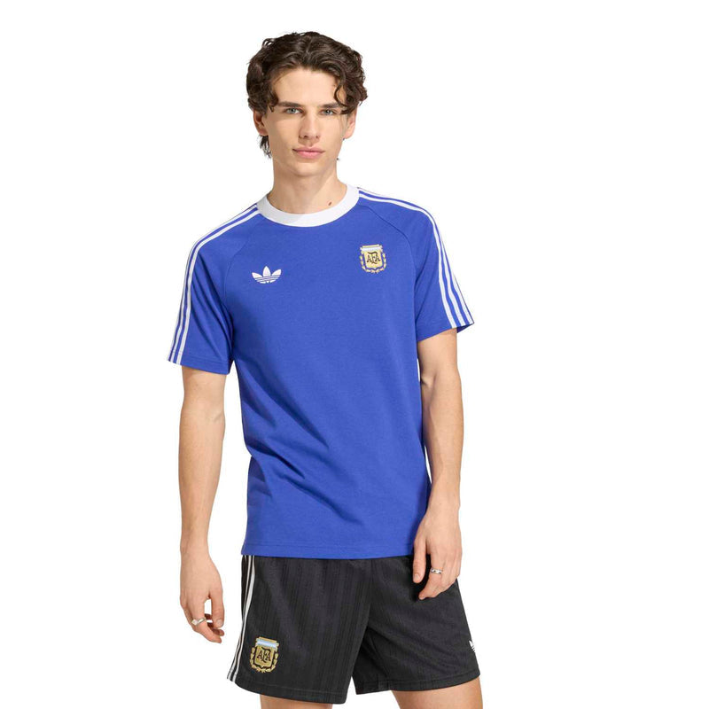 Men's blue soccer T-shirt with white sleeve stripes and Argentina crest on the chest
