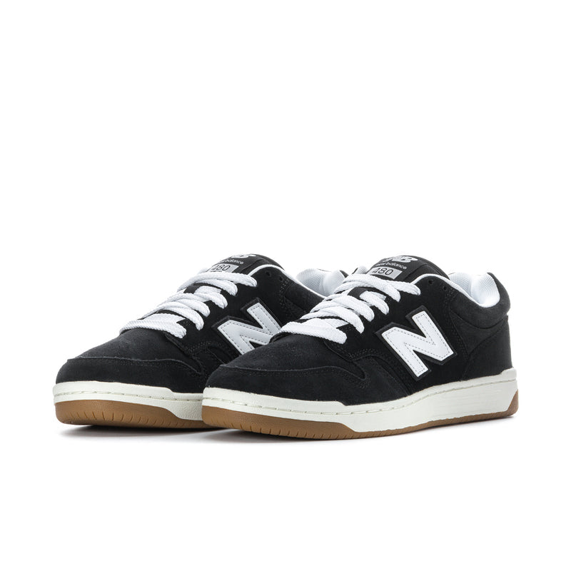 Pair of men’s black New Balance 480 lace-up sneakers with white N logos and gum soles