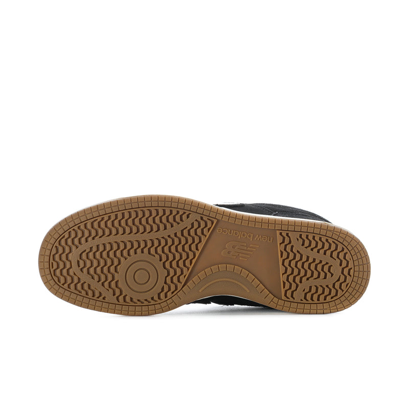 New Balance 480 sneaker outsole in tan/gum with textured tread and center logo