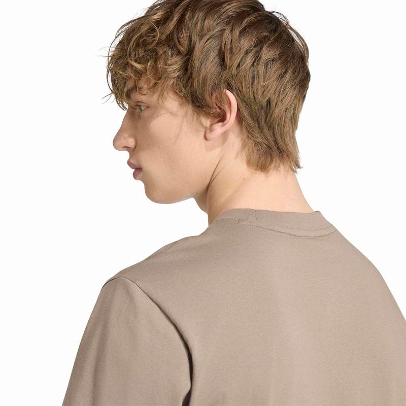 Khaki men's T-shirt from side profile, showing crew neck and small adidas logo