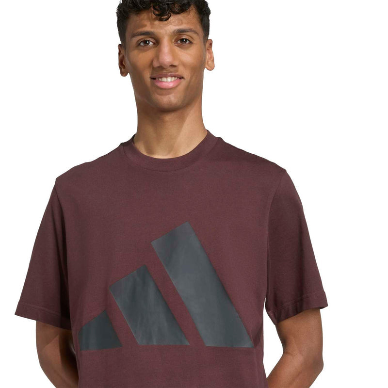 Men's brown crew-neck T-shirt with large blue-gray logo print, close-up