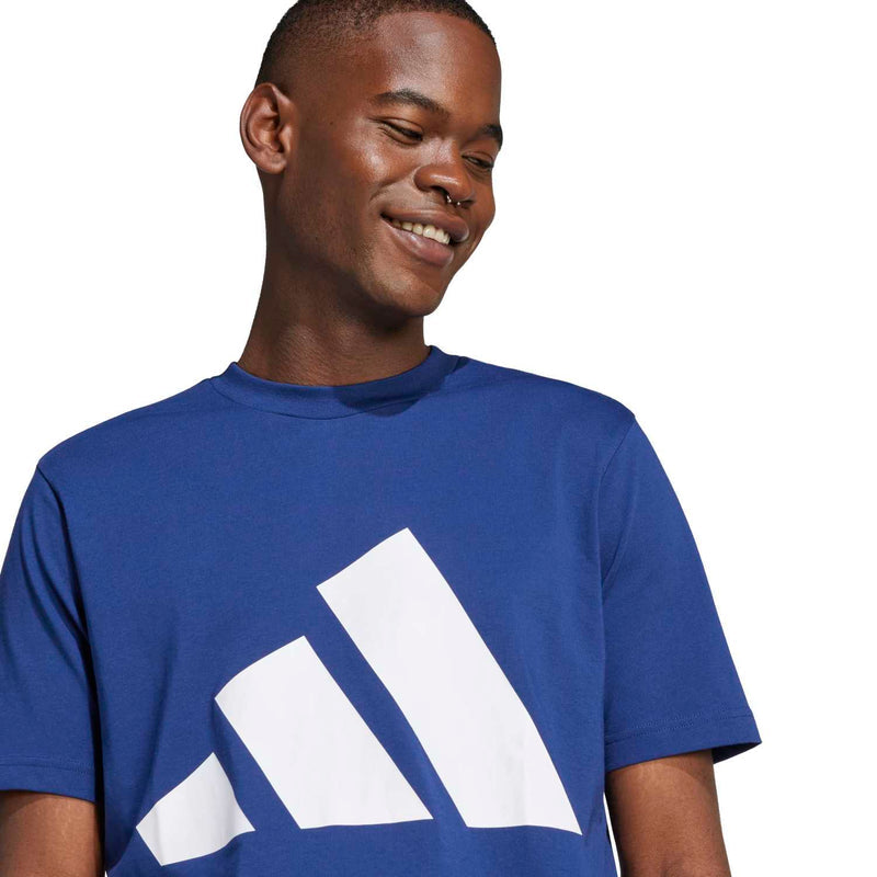 Men's navy T-shirt with white logo print, close-up on chest graphic