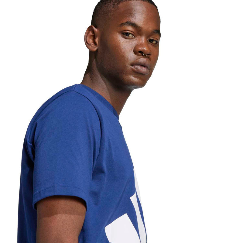 Men's navy T-shirt, side view with white logo graphic partly visible