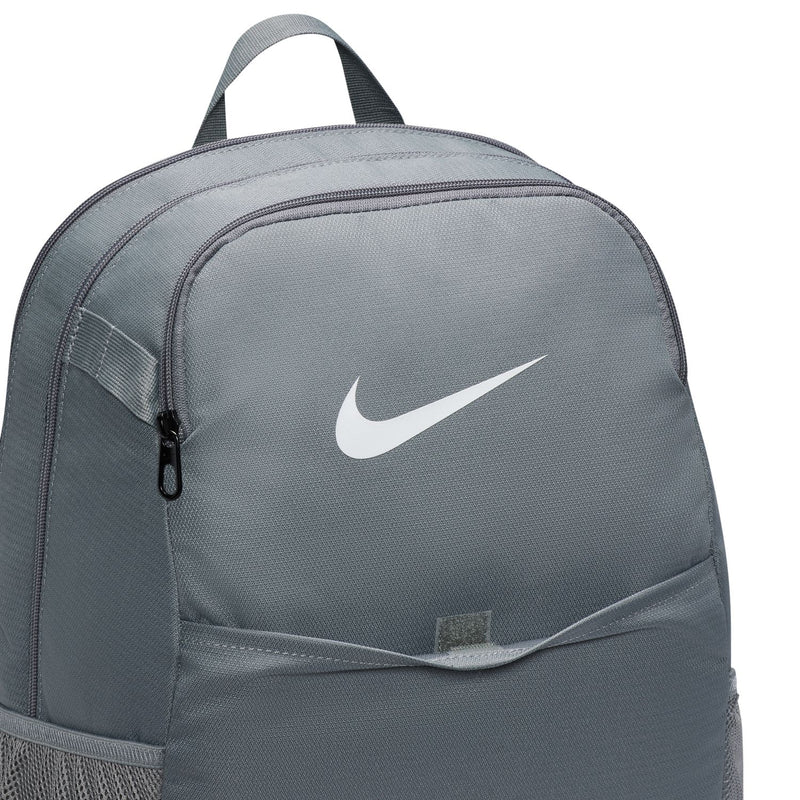 Nike Brasilia medium backpack close-up with white swoosh logo on smoke grey panel