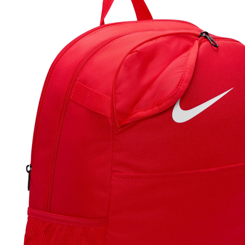 Red backpack with Nike swoosh and front zip pocket, medium size with top handle.