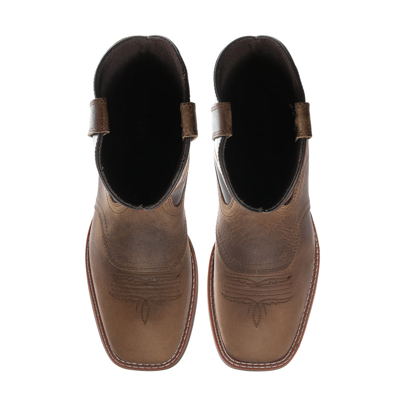 Tan leather cowboy boots with black padded collar and ankle pull tabs