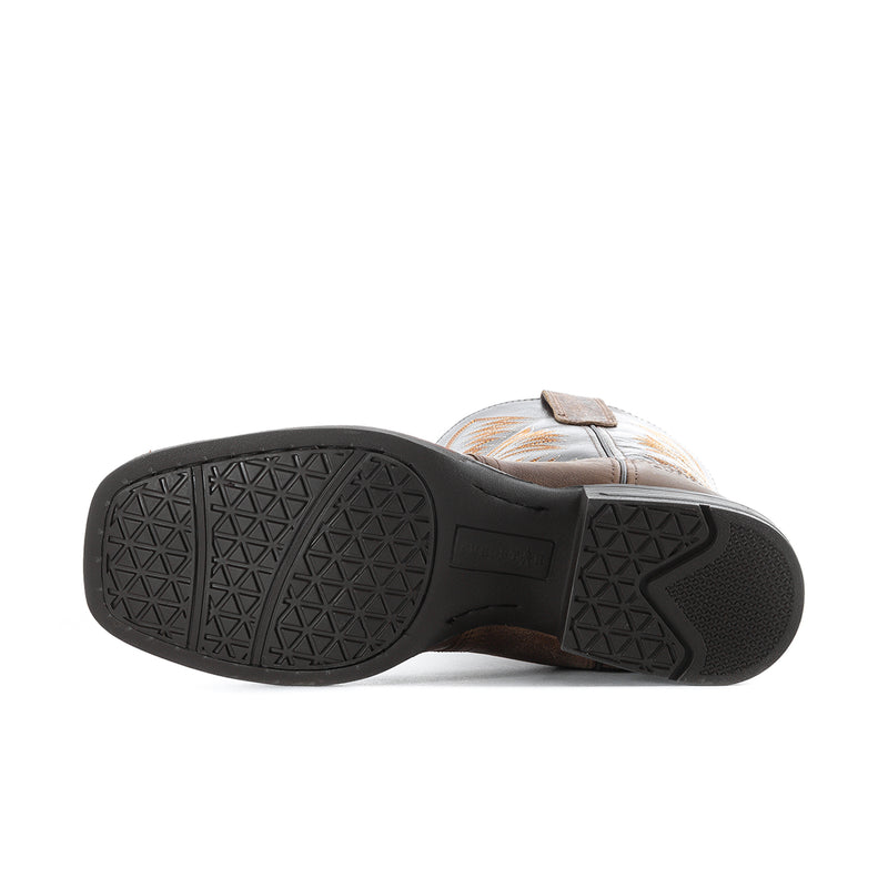 Boot outsole with textured rubber tread and dark heel section