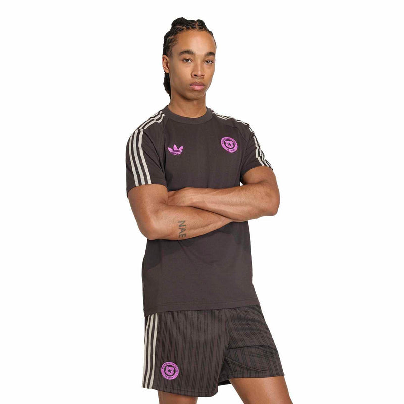 Mens dark brown tee with purple chest logo, white side shoulder stripes, short sleeves