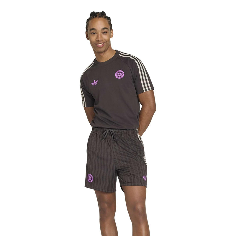 Mens dark brown tee with purple logos and white sleeve stripes, crew neck