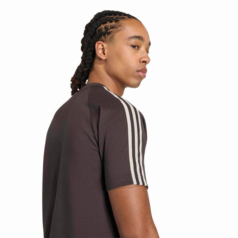 Mens dark brown tee side view with white shoulder stripes and purple chest logo