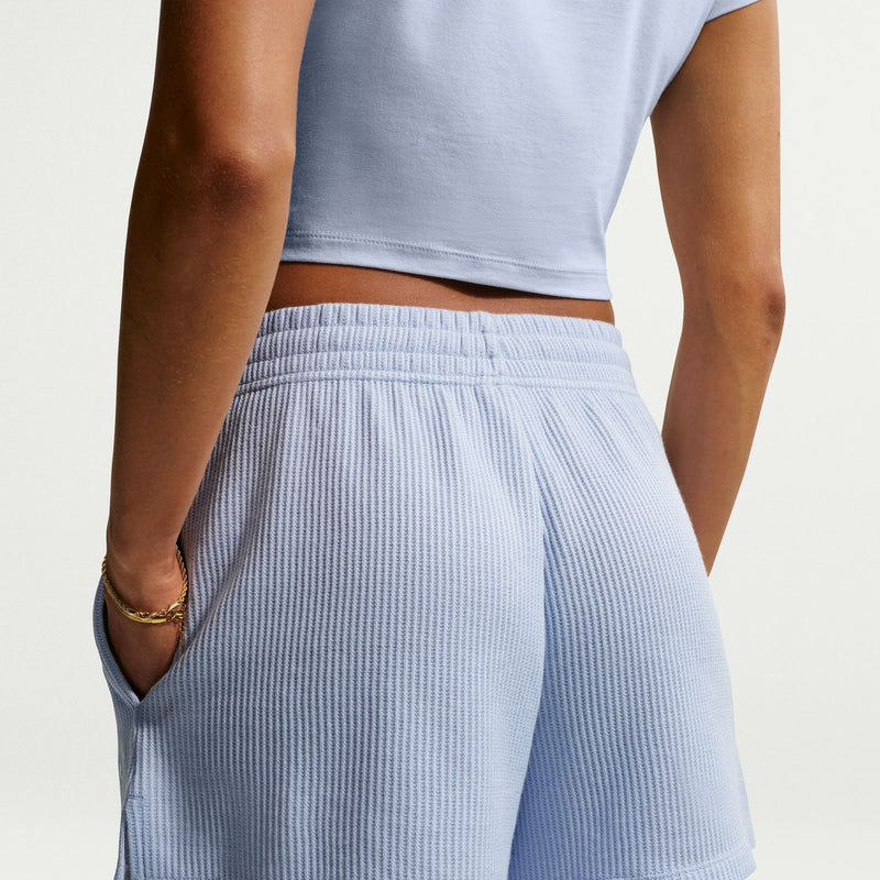 Light blue knit waffle shorts close-up: elastic waistband with gathered front