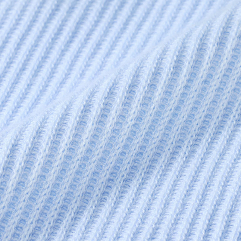 Close-up of light blue waffle knit fabric texture