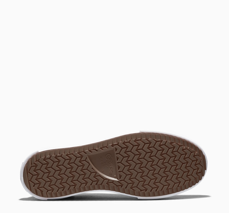 Kids sneaker outsole with brown herringbone tread pattern