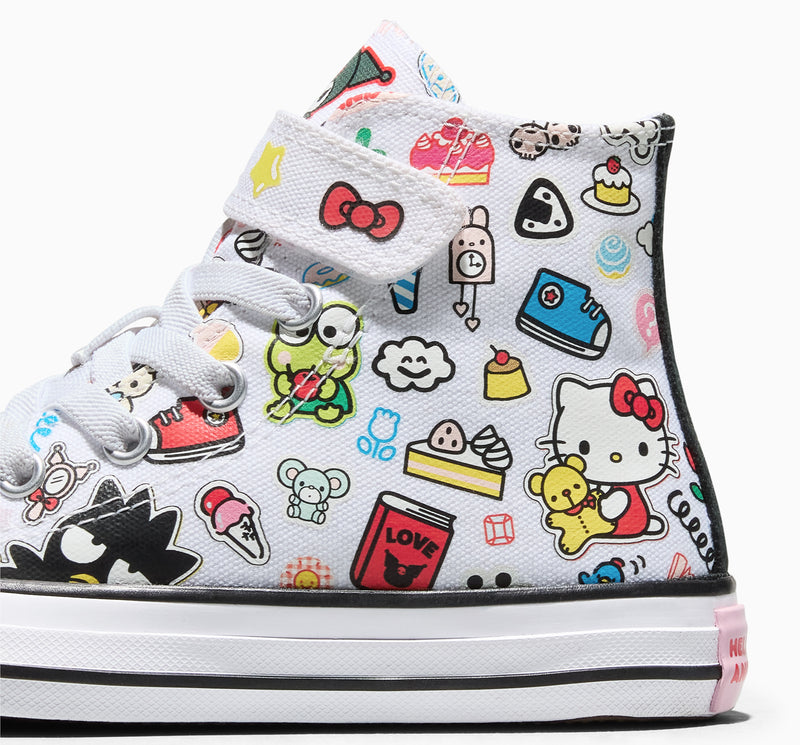 Kids high-top sneakers close-up, white canvas with Hello Kitty character collage