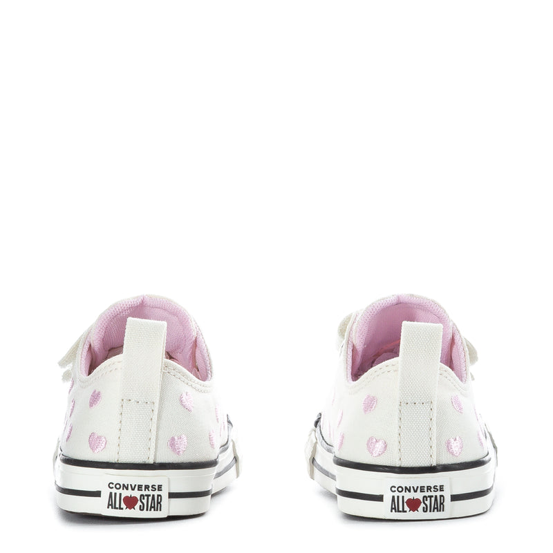 Toddler low-top sneakers back view, white canvas with pink hearts, Converse All Star logo