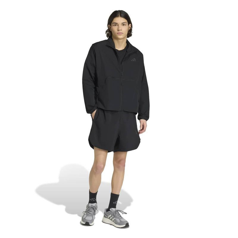 Black men's tech shorts with drawstring waistband and above-knee length.