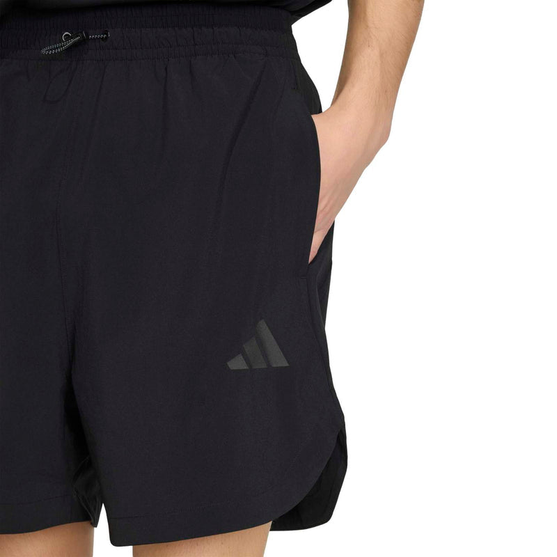 Black men's tech shorts with side logo and relaxed above-knee cut.