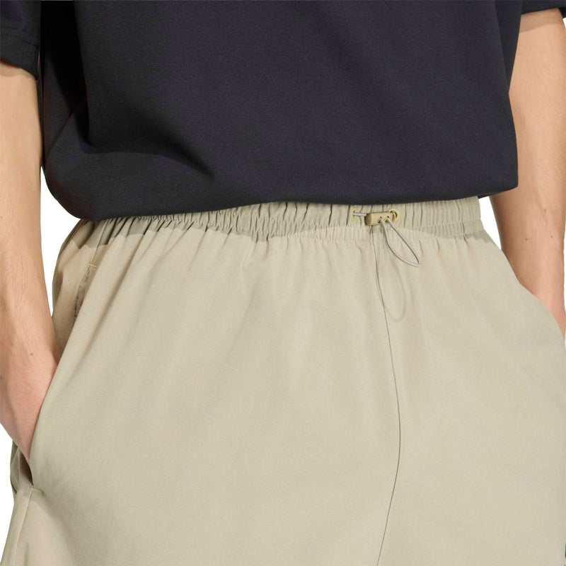 Men's khaki tech shorts with elastic waistband and drawstring cord