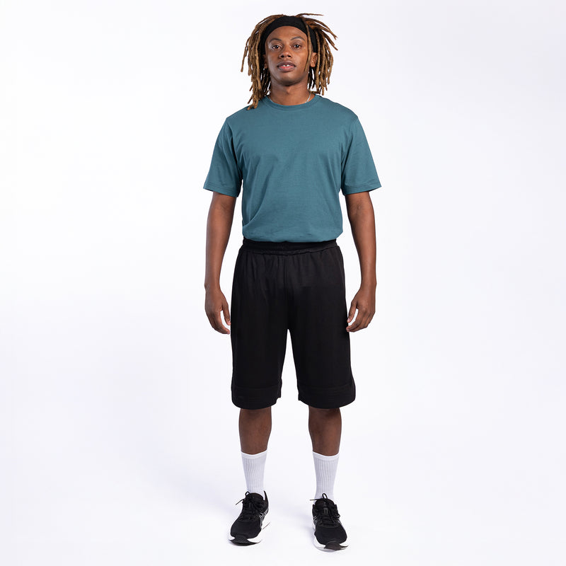 Men's black basketball shorts worn on model with elastic waist and knee-length hem