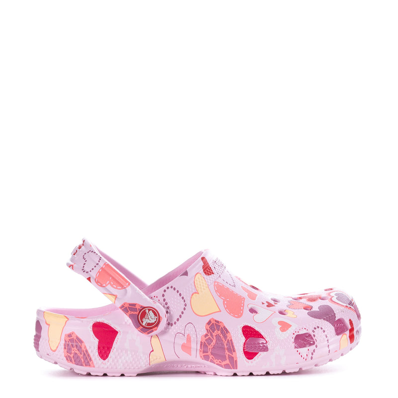 Women's pink heart-print clog with adjustable heel strap and slip-on upper