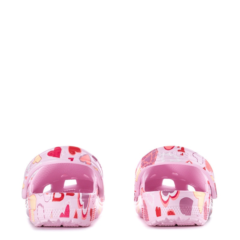 Pair of women's pink heart-print clogs with rounded toe windows