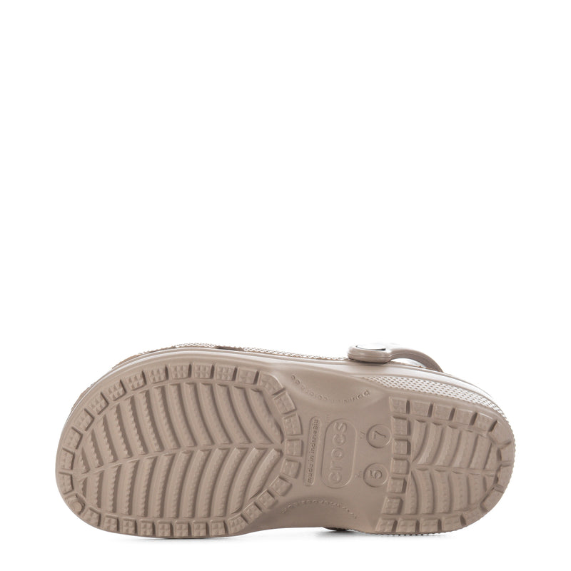 Taupe clog outsole with rugged tread pattern on the bottom