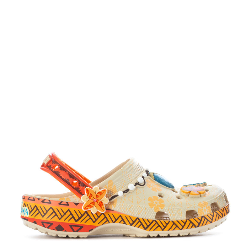 Youth clog in orange with patterned canvas top and flower charm, perforated sides