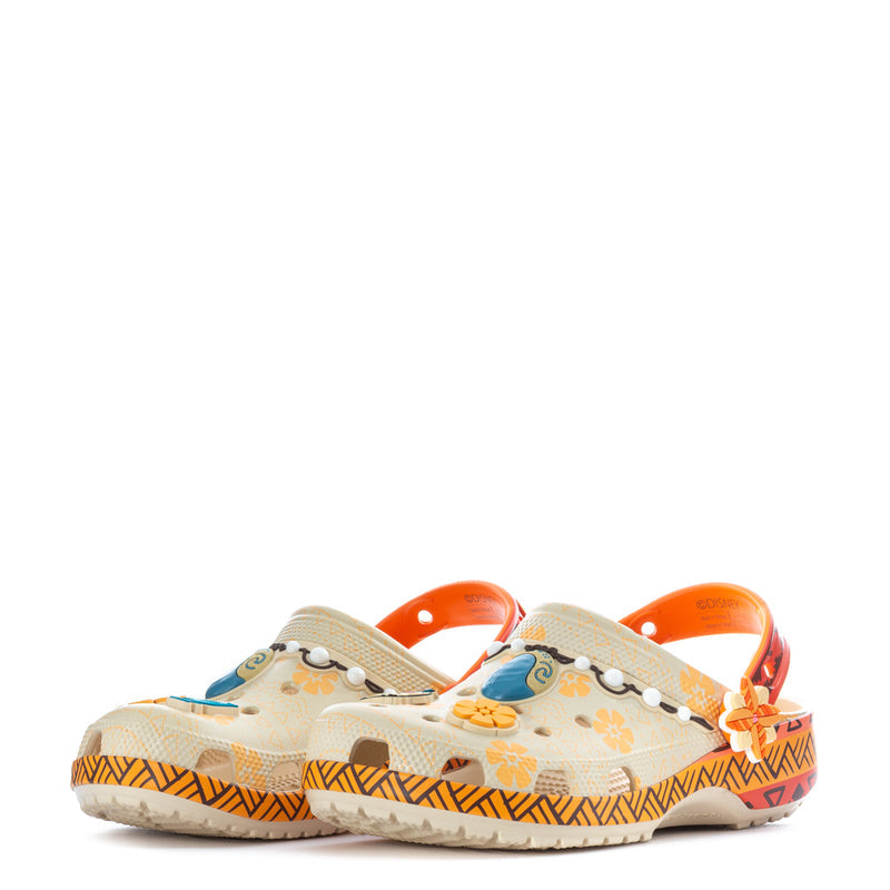 Pair of youth clogs with orange heel strap and beige patterned uppers, bead strap detail