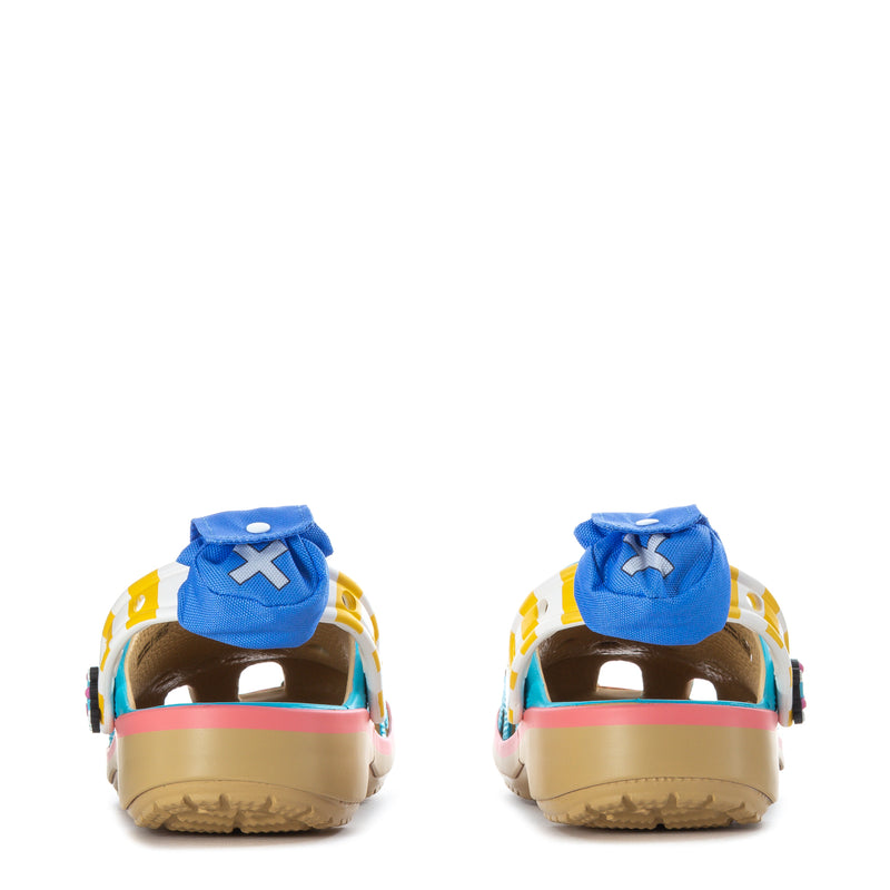 Back view of teal youth clogs with blue heel strap and pink trim along the sole
