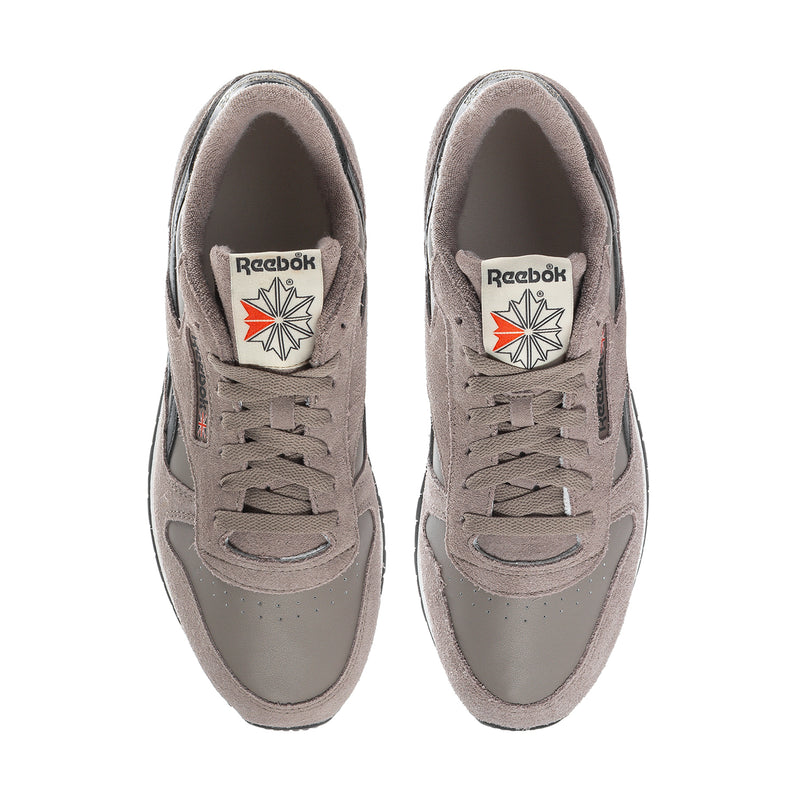 Reebok men's light gray suede sneakers with lace-up closure and cushioned collars