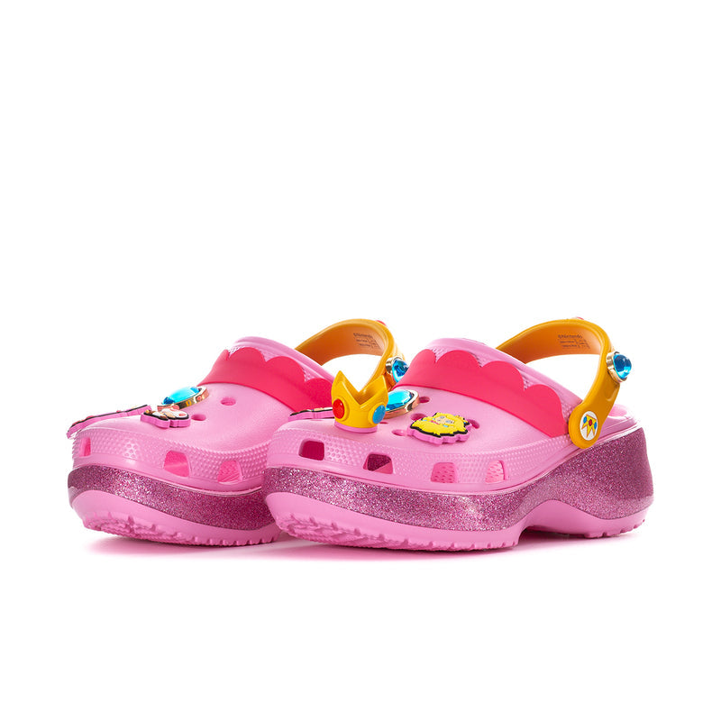 Womens pink platform clog pair, yellow side straps, glitter midsole, charm accents