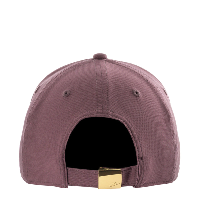 Nike club cap in mauve with interior black panel and gold adjustable strap buckle