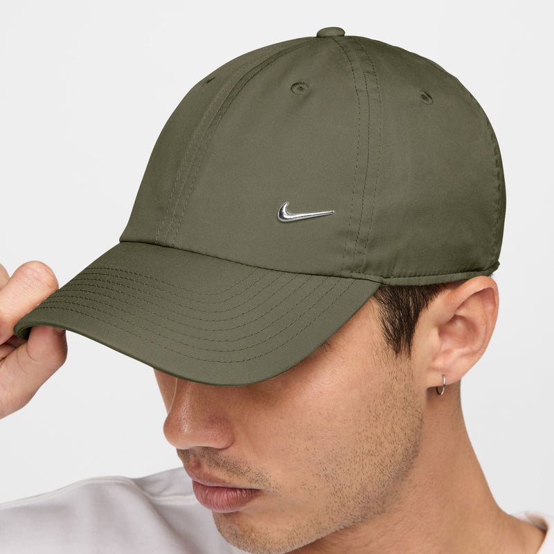 Medium olive strapback cap with silver Nike Swoosh on front panel, curved brim