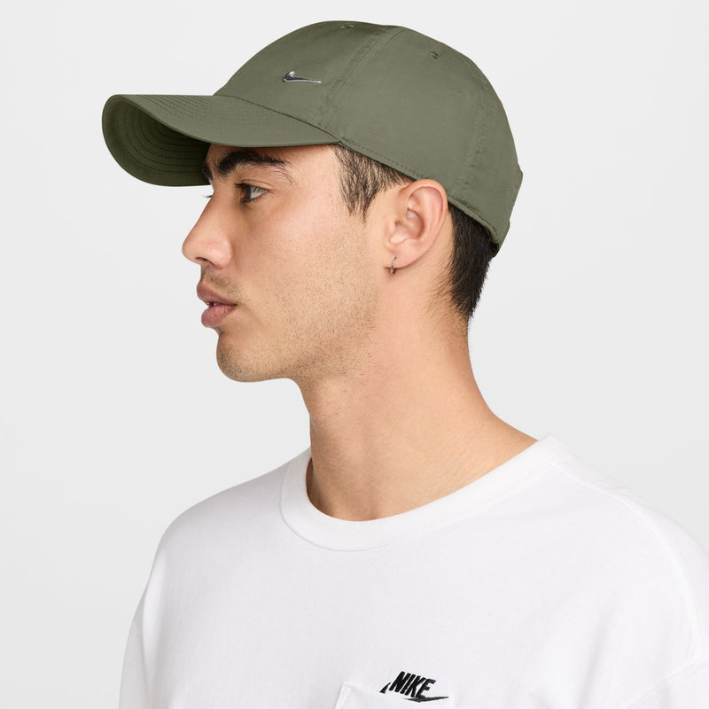 Medium olive Nike strapback cap, side profile with silver Swoosh and curved brim