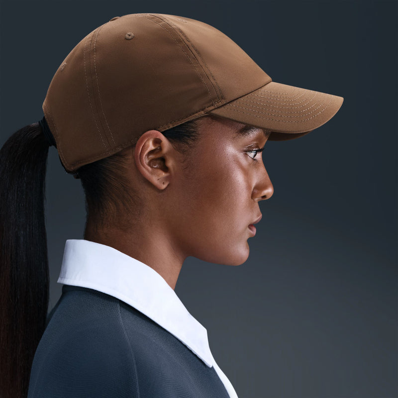 Mosswood brown Nike strapback cap worn by model, side view