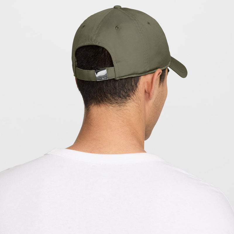 Medium olive Nike strapback cap back view with metal adjuster and curved brim